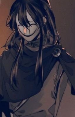 a guy in black with face hidden by a sadly smiling mask