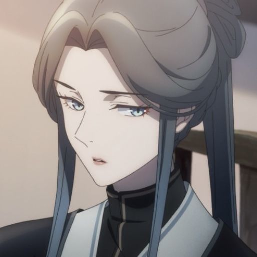 A tired looking lady with bluish grey hair and eyes